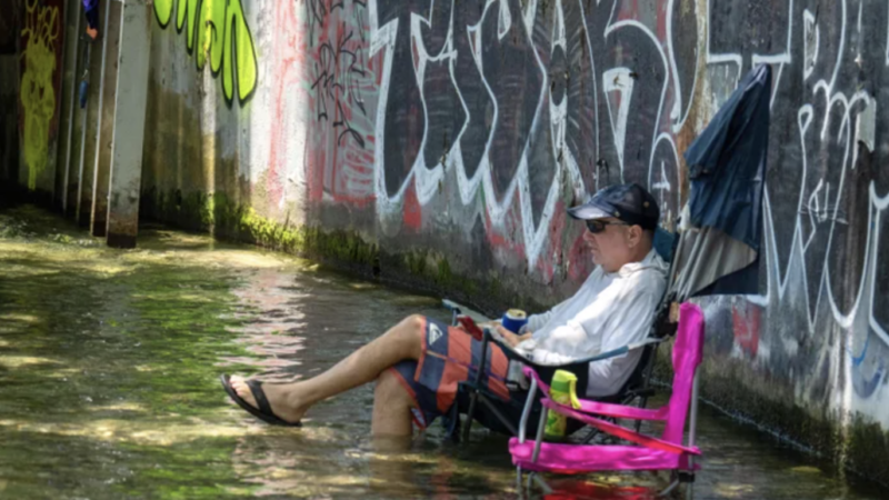 Residents cool off at Barton Creek in Austin, Tex., during a June heat wave. Parts of Texas have seen weeks of punishing heat and humidity | Suzanne Cordeiro/AFP via Getty Images