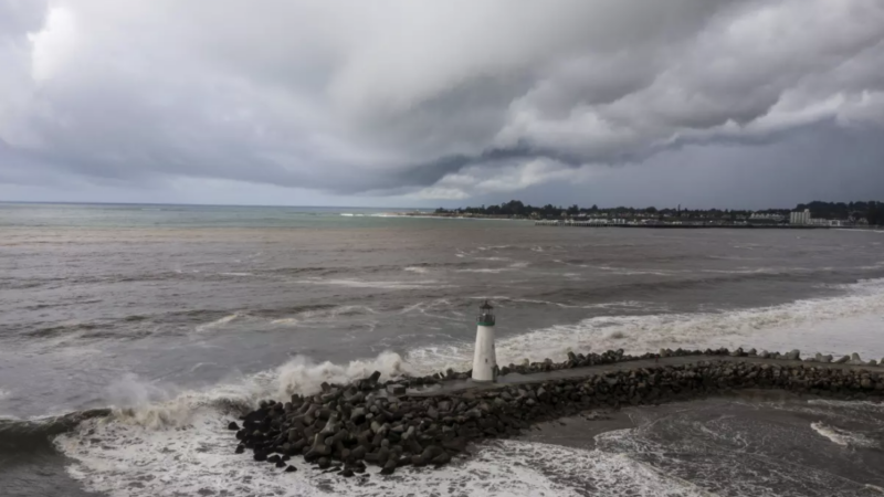 Storm clouds hang over Walton Lighthouse on Thursday in Santa Cruz The first of two back-to-back atmospheric rivers drenched California on Thursday