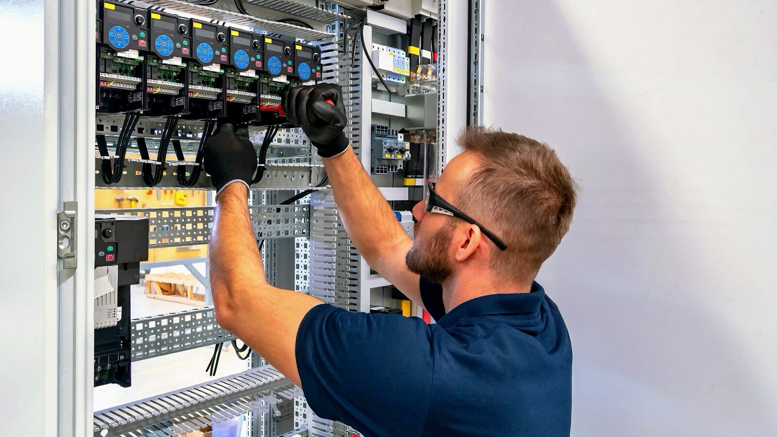 Electrician working on electric panel