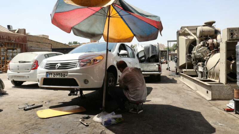 Iranian mechanic works during the heat surge in Tehran