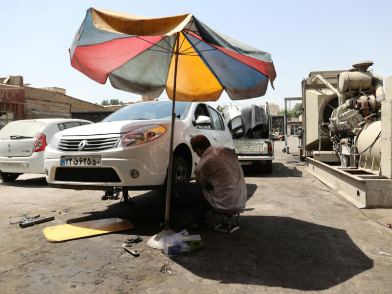 Iranian mechanic works during the heat surge in Tehran